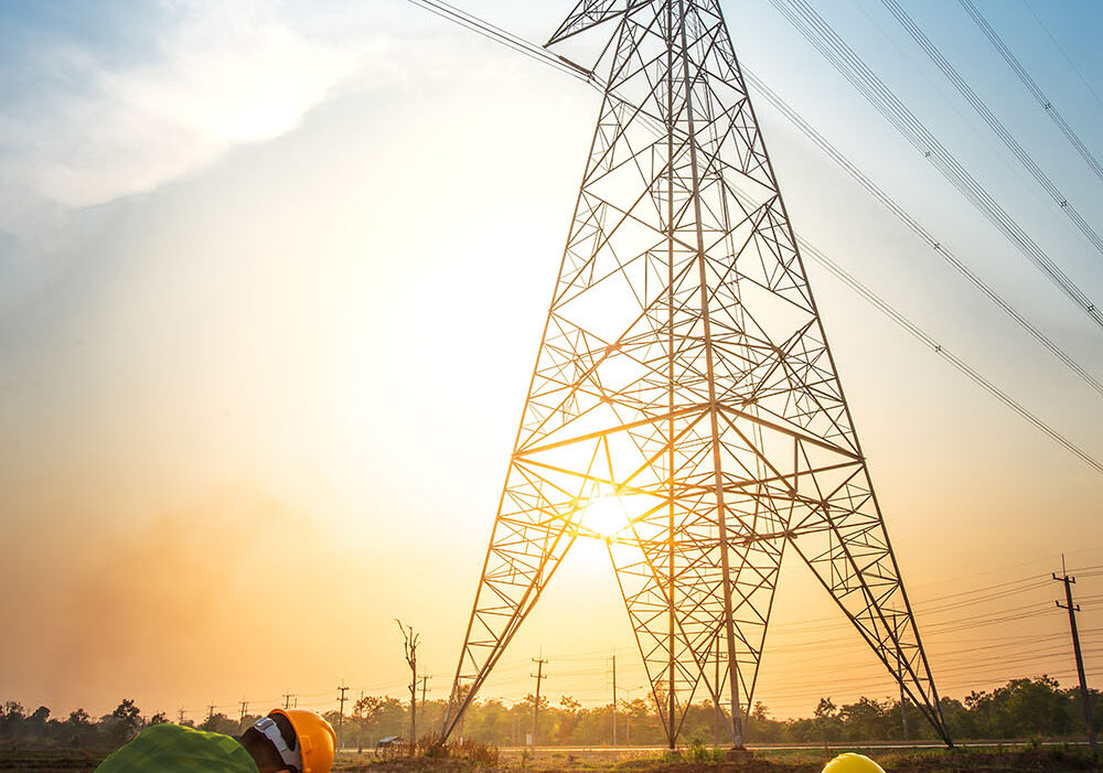 Picture of two electrical engineers checking electrical work by